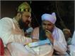 Dilbar Sain and pir mitha Sani discusing